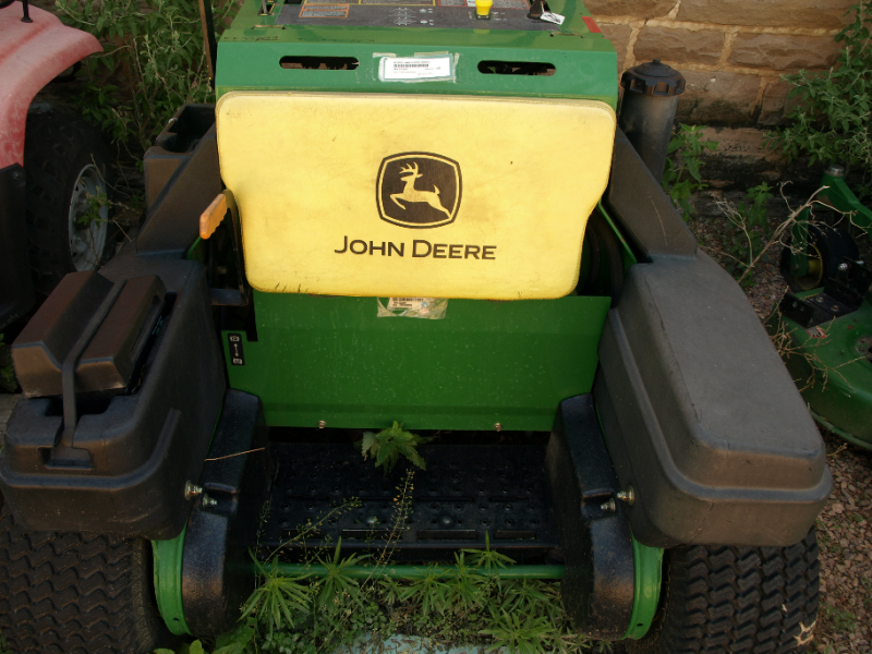Two John Deere Mowers and a Four Wheeler