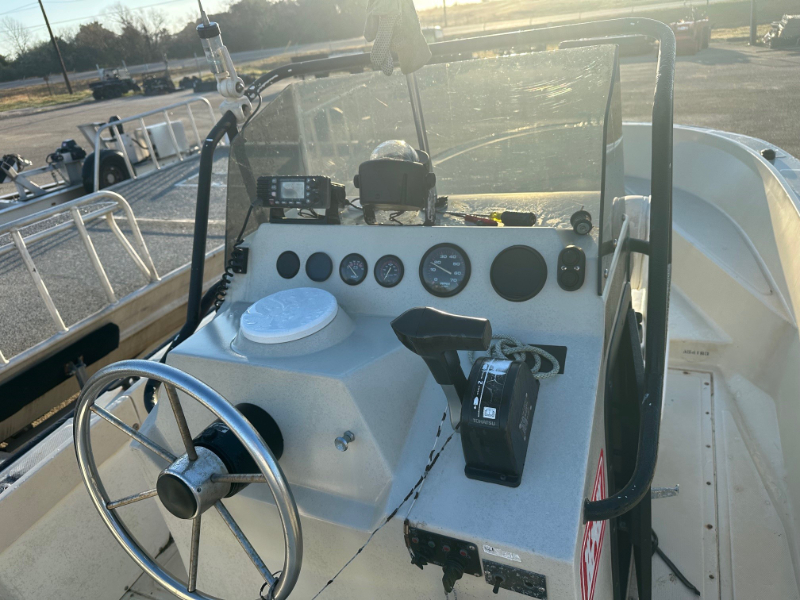Boston Whaler with Outboard Engine and Trailer